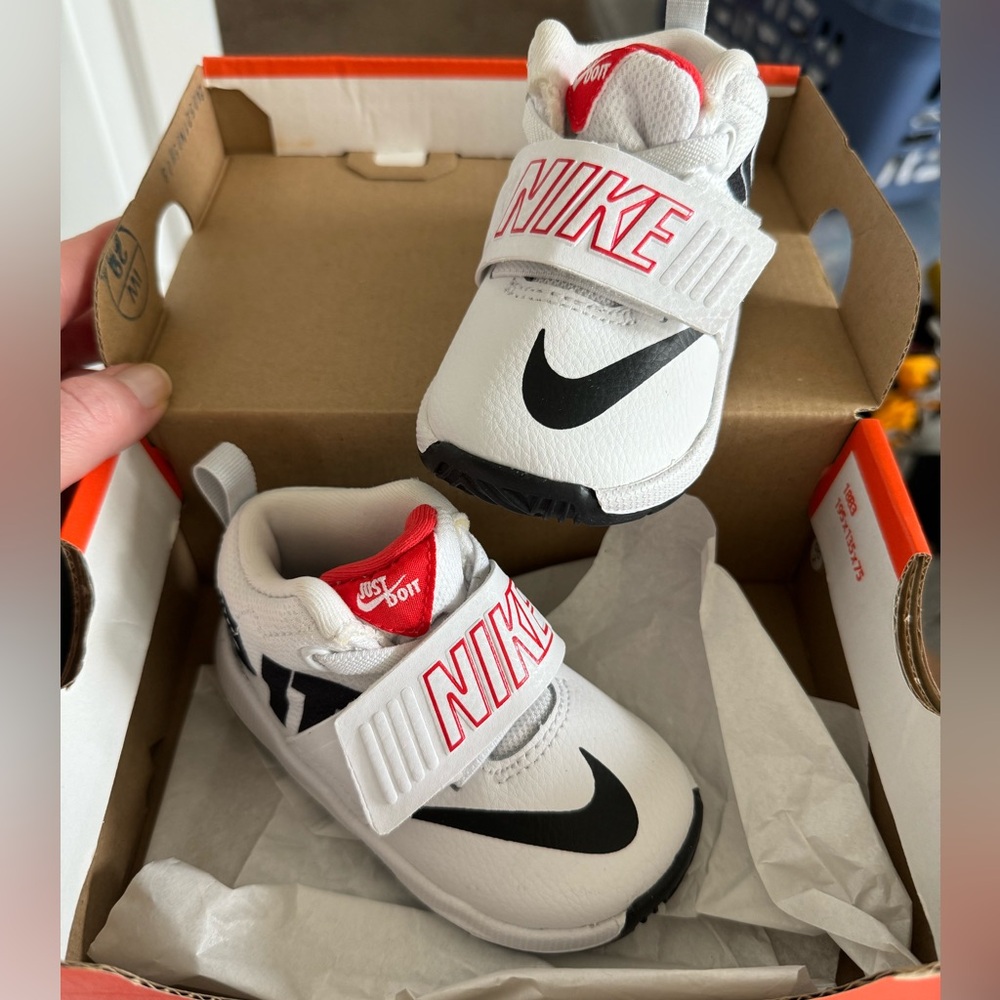 New in box Nike team hustle shoes, size 5c
